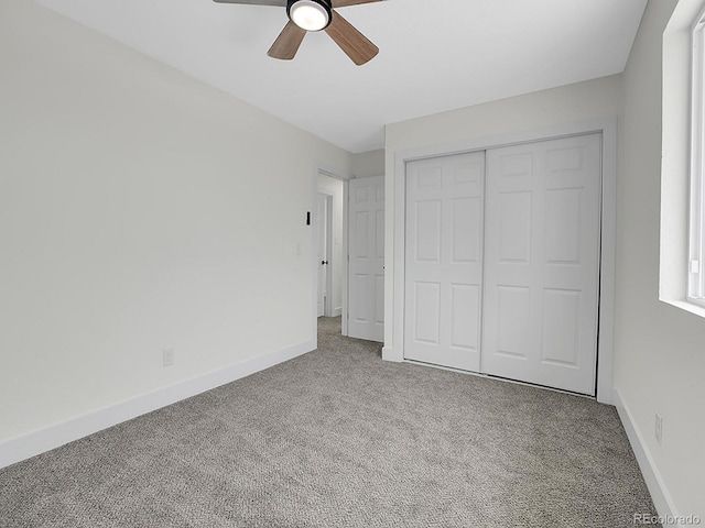 8694 E Eastman Ave, Denver, CO 80231 - unfurnished bedroom featuring carpet, baseboards, a closet, and ceiling fan