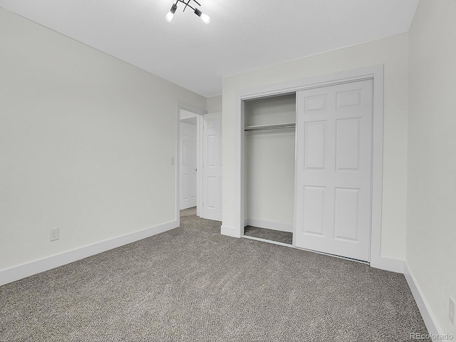 8694 E Eastman Ave, Denver, CO 80231 - unfurnished bedroom featuring carpet, a closet, and baseboards