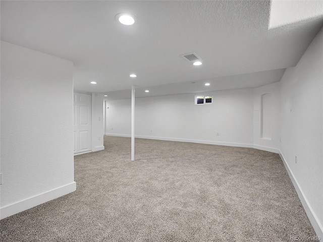8694 E Eastman Ave, Denver, CO 80231 - finished basement featuring carpet floors and recessed lighting