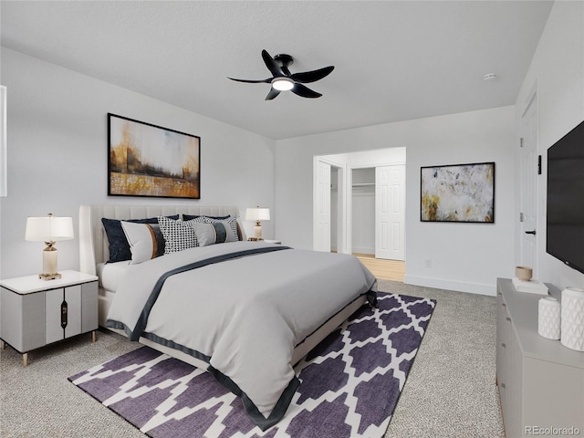 8694 E Eastman Ave, Denver, CO 80231 - bedroom featuring light carpet, a ceiling fan, and a closet