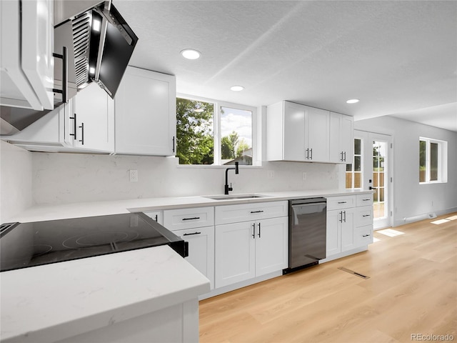 8694 E Eastman Ave, Denver, CO 80231 - kitchen with dishwasher, tasteful backsplash, recessed lighting, light wood-style floors, and white cabinets