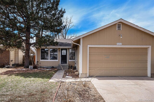 ranch-style home with a garage