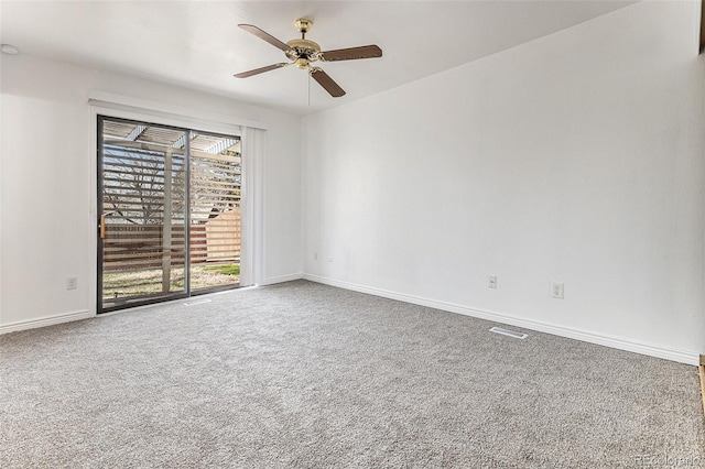 carpeted empty room with ceiling fan