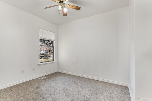 carpeted empty room featuring ceiling fan