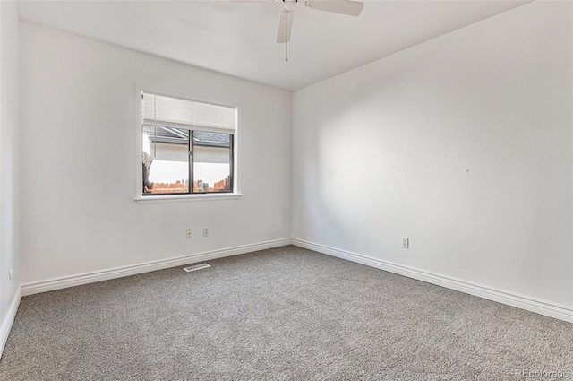 carpeted empty room featuring ceiling fan