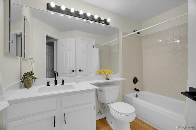 1717 Tulip St, Longmont, CO 80501 - bathroom with vanity,  shower combination, and wood finished floors