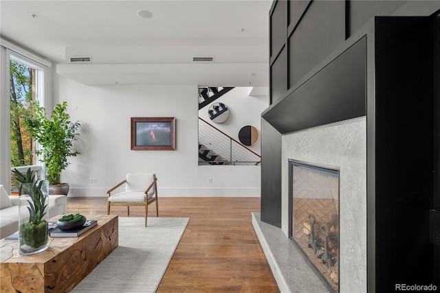 corridor with light hardwood / wood-style flooring