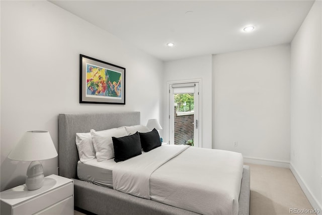 bedroom with light colored carpet