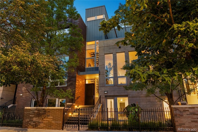 1804 Little Raven St, Denver, CO 80202 - contemporary home with a fenced front yard and brick siding