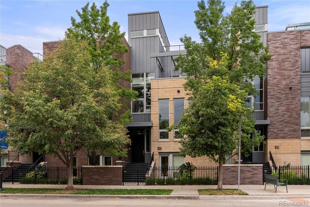 1804 Little Raven St, Denver, CO 80202 - view of building exterior featuring a fenced front yard