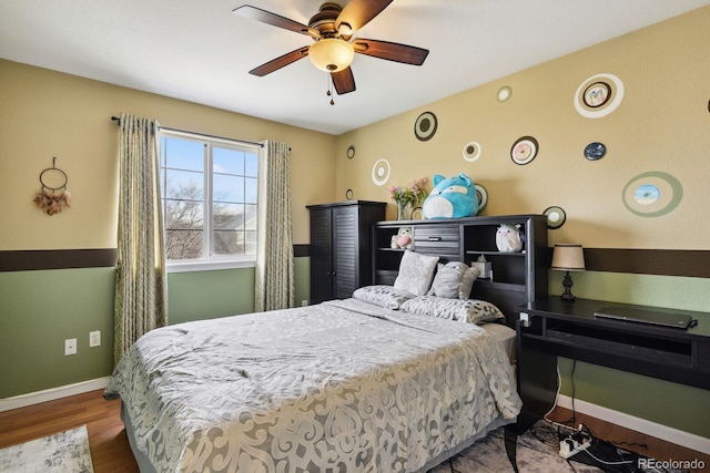 bedroom featuring hardwood / wood-style floors and ceiling fan