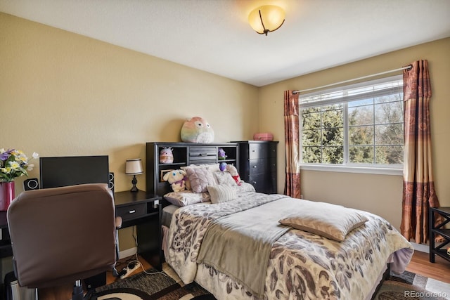 bedroom with wood-type flooring