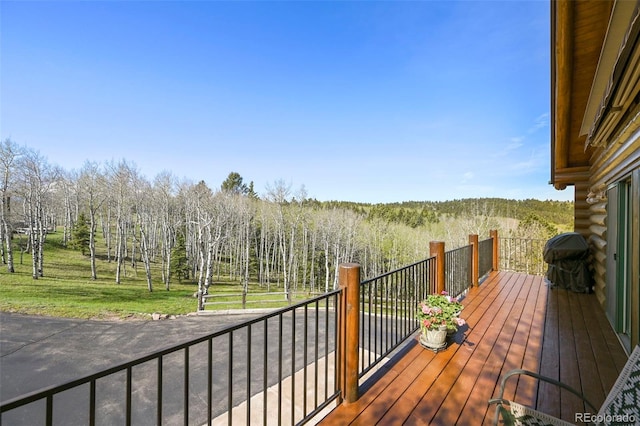 11690 Rampart Range Rd, Woodland Park, CO 80863 - deck featuring grilling area and a wooded view