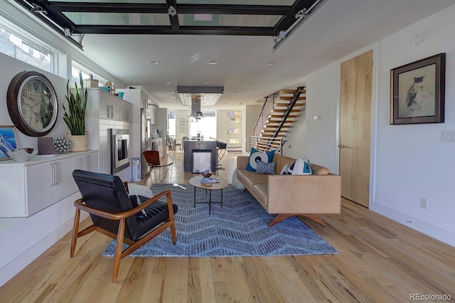 living room with light hardwood / wood-style flooring and plenty of natural light