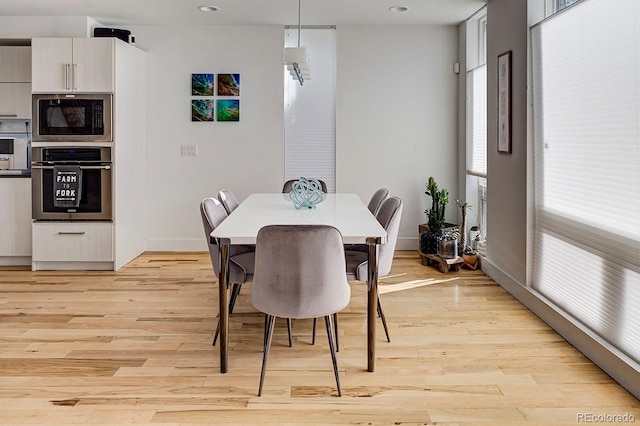 dining room with light hardwood / wood-style flooring