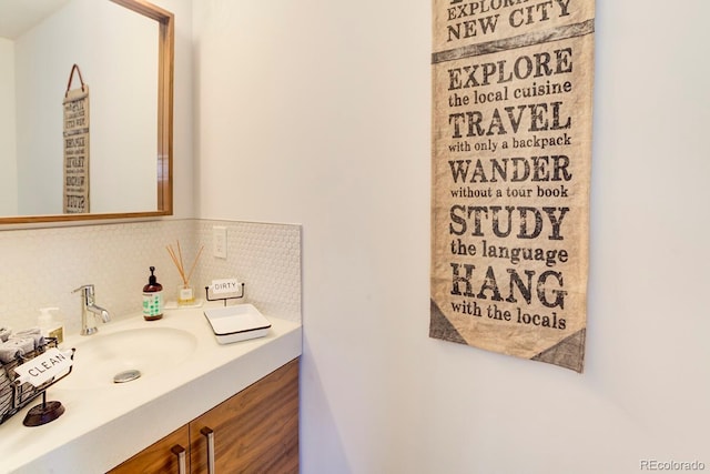 bathroom with backsplash and vanity