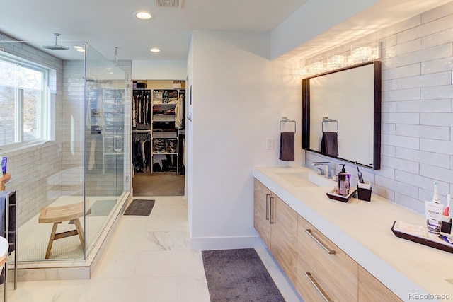 bathroom with vanity and an enclosed shower