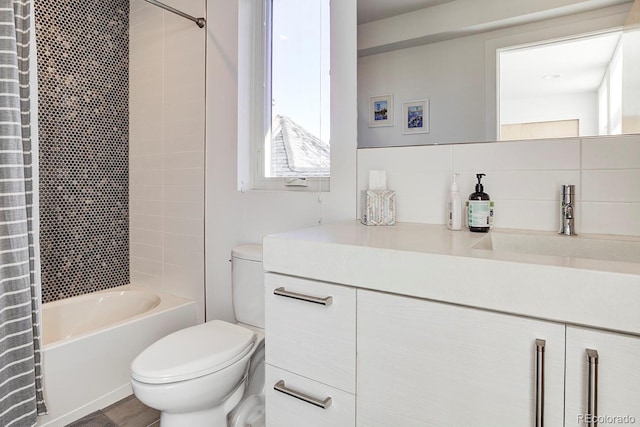 full bathroom with shower / tub combo, vanity, tasteful backsplash, and toilet