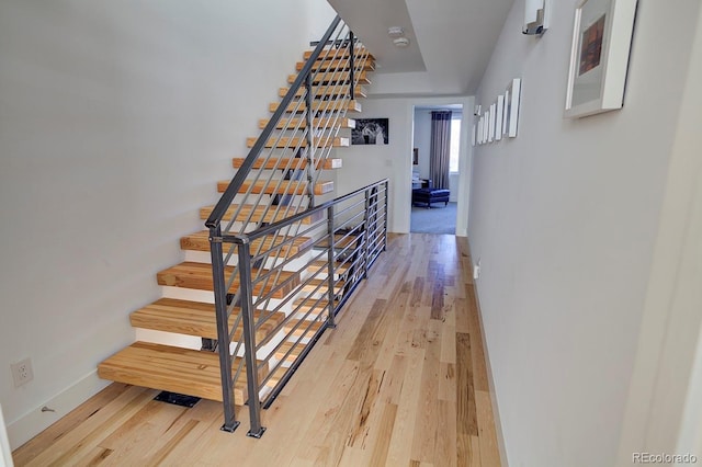 staircase featuring hardwood / wood-style flooring