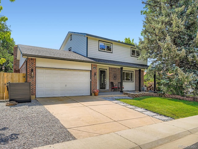 7520 Braun Ct, Arvada, CO 80005 - traditional-style house with a garage, brick siding, concrete driveway, and covered porch