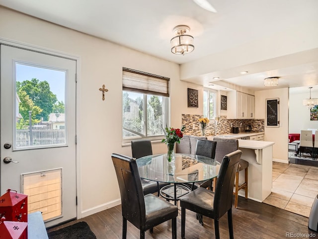 7520 Braun Ct, Arvada, CO 80005 - dining area featuring a chandelier and wood finished floors