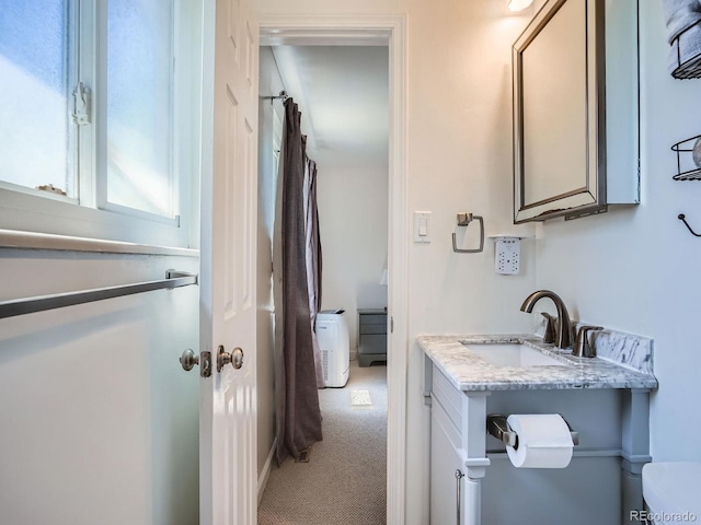 7520 Braun Ct, Arvada, CO 80005 - bathroom with toilet and vanity