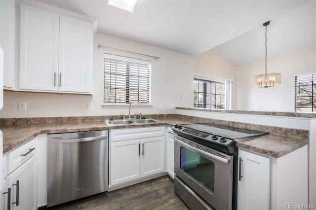 2172 Denton Grv Unit 203, Colorado Springs, CO 80919 - kitchen with a peninsula, appliances with stainless steel finishes, plenty of natural light, and a sink