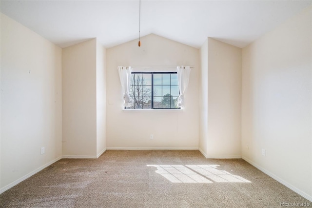 2172 Denton Grv Unit 203, Colorado Springs, CO 80919 - spare room with carpet flooring, baseboards, and lofted ceiling