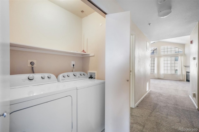 2172 Denton Grv Unit 203, Colorado Springs, CO 80919 - laundry area with washing machine and dryer, laundry area, and light colored carpet