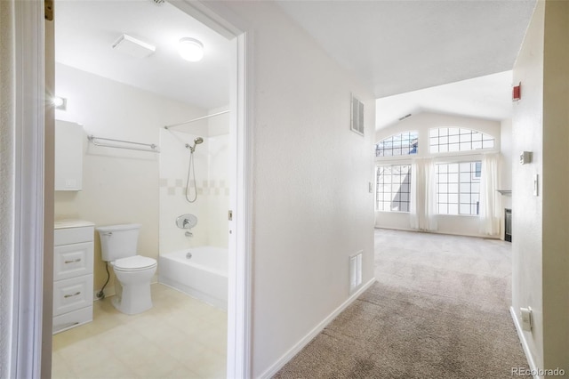 2172 Denton Grv Unit 203, Colorado Springs, CO 80919 - bathroom featuring toilet, visible vents, shower / bathing tub combination, and vaulted ceiling