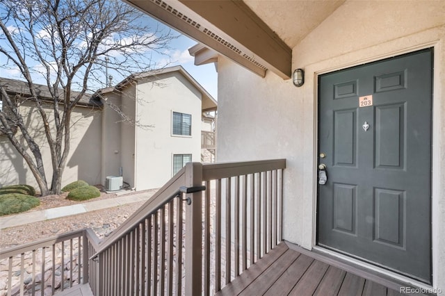 2172 Denton Grv Unit 203, Colorado Springs, CO 80919 - view of exterior entry featuring central AC and stucco siding