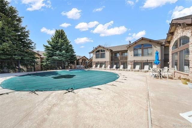2172 Denton Grv Unit 203, Colorado Springs, CO 80919 - community pool featuring a patio and fence