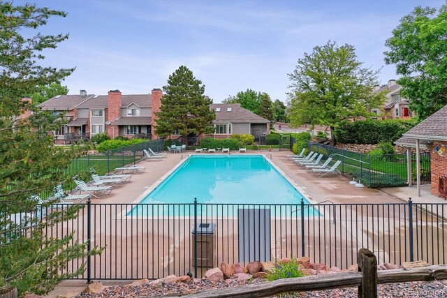 4231 S Fairplay Cir # E, Aurora, CO 80014 - community pool featuring a patio area and a residential view