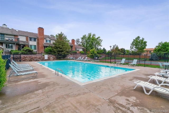 4231 S Fairplay Cir # E, Aurora, CO 80014 - community pool with a patio and a residential view