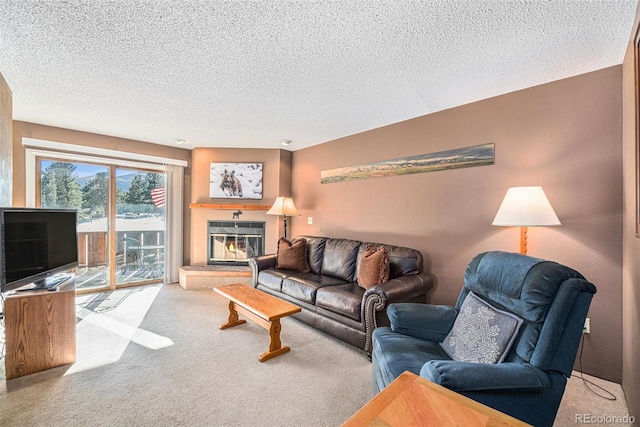 living room featuring light carpet and a textured ceiling