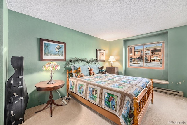 bedroom featuring a baseboard heating unit, a textured ceiling, and carpet flooring