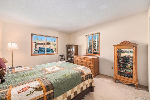 carpeted bedroom with a textured ceiling