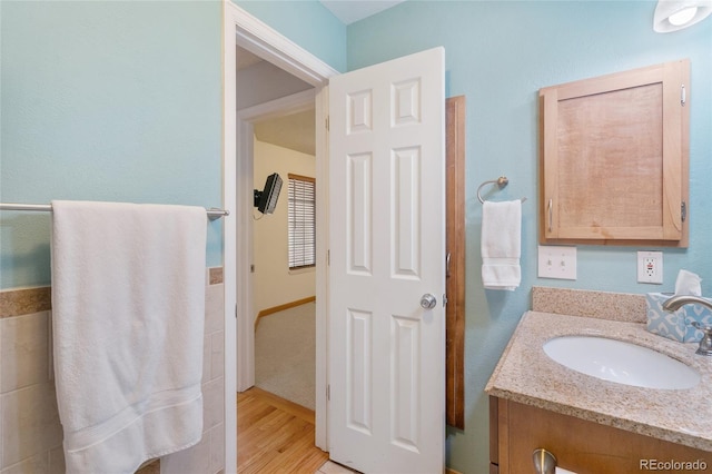 bathroom featuring vanity and wood-type flooring