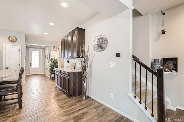 kitchen featuring dark brown cabinets and hardwood / wood-style floors