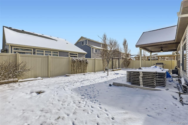 view of yard covered in snow