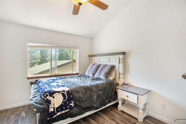 bedroom featuring dark wood-type flooring, ceiling fan, and vaulted ceiling