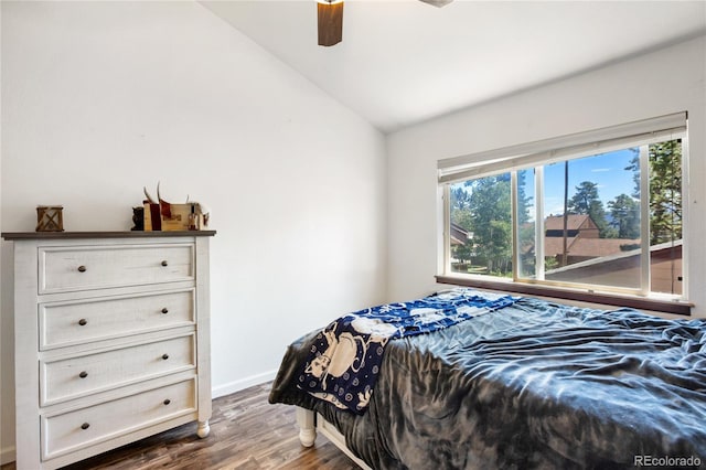 bedroom featuring lofted ceiling, ceiling fan, and dark wood-type flooring