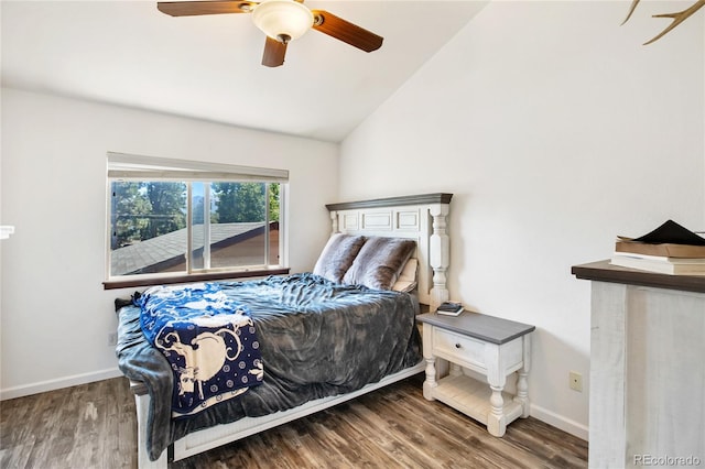 bedroom featuring dark wood-type flooring, lofted ceiling, and ceiling fan