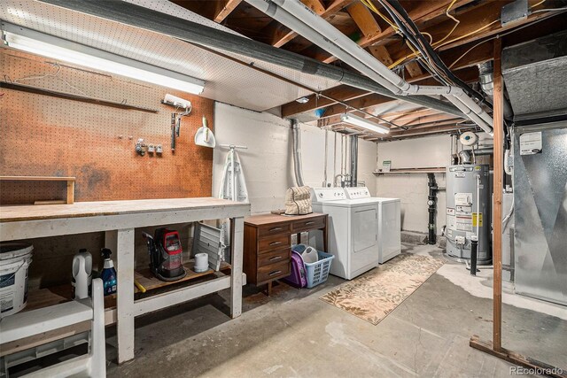unfinished basement with water heater, washing machine and clothes dryer, a workshop area, and heating unit
