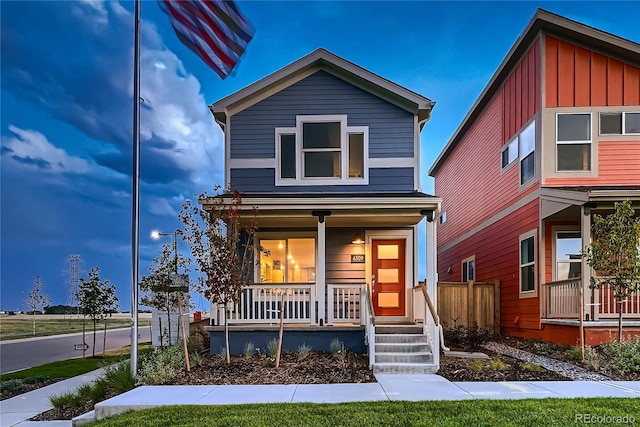 6309 N Hanover St, Denver, CO 80238 - view of front of property featuring a porch and board and batten siding