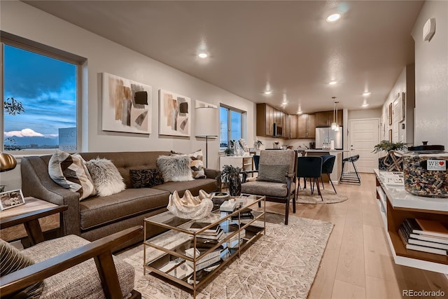 6309 N Hanover St, Denver, CO 80238 - living area with light wood-style floors and recessed lighting