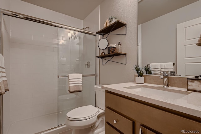 6309 N Hanover St, Denver, CO 80238 - full bath with vanity, a stall shower, toilet, and a textured wall