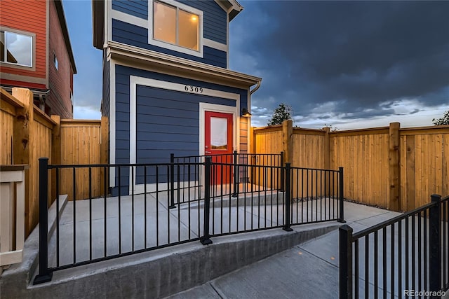 6309 N Hanover St, Denver, CO 80238 - view of front facade with a fenced backyard and a patio