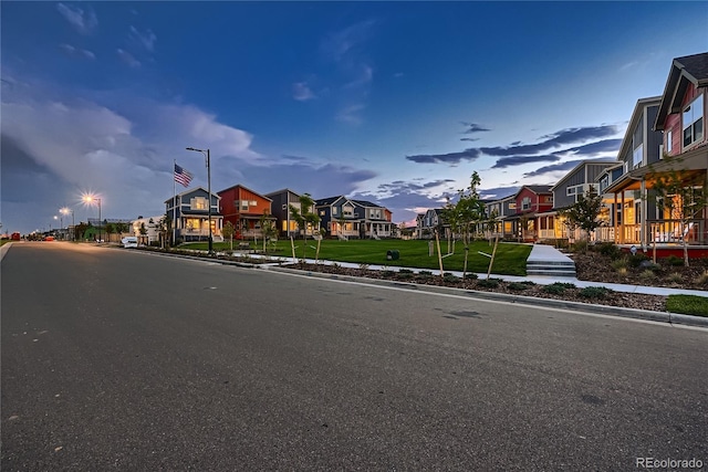 6309 N Hanover St, Denver, CO 80238 - view of asphalt road with a residential view, sidewalks, curbs, and street lighting