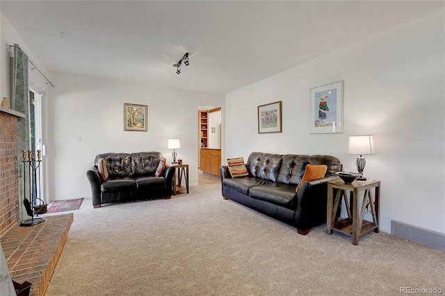 living room featuring carpet floors and a fireplace